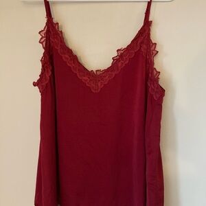 Red top with lace detailing. Size Large.